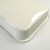 Close up of corner of white enamel cooking tray showing rounded lip