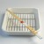 White enamel cooking tray with saibashi cooking chopsticks