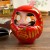 Large Daruma figurine on desktop