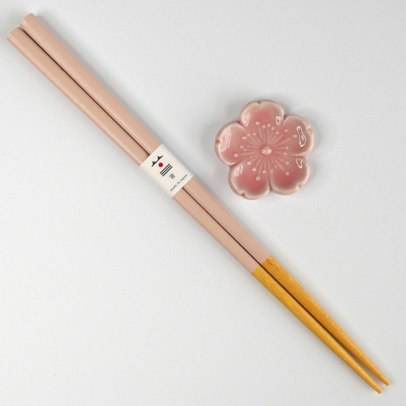 Pastel pink chopsticks with matching pink flower shaped chopstick rest