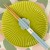 Pastel baby blue chopsticks and chopstick rest on vibrant green plate