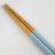 Close up of wooden tips of pastel blue chopsticks
