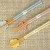 Pastel chopstick and chopstick rest sets in pastel pink, yellow and blue on a table