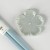 Pastel blue chopsticks with matching pale blue flower shaped chopstick rest