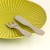 Mini Japanese stainless steel fork and spreader on a green side plate
