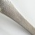 Close up of 'tsuchime' hammered metal finish on stainless steel serving spoon